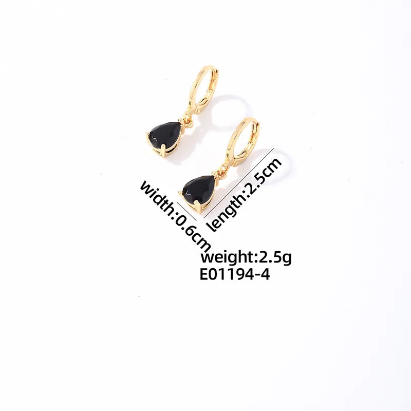 Stalen Huggie Oorringen Goudkleurig met Hangende Zwarte Druppel Zirkonia 25 mm