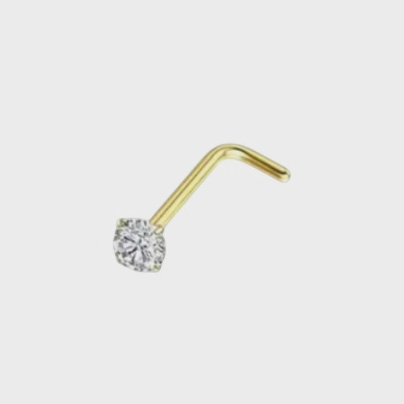 Aramat Jewels goudkleurige neuspiercing met een transparante zirkonia steen op een L-vormig chirurgisch stalen staafje