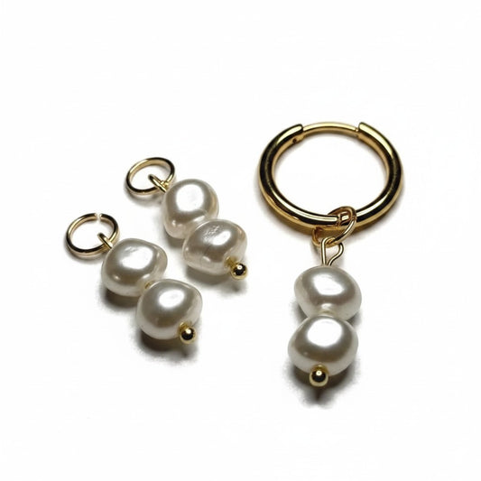 Aramat Jewels white synthetic pearl charms for necklaces or earrings with gold-tone hardware on a white background.