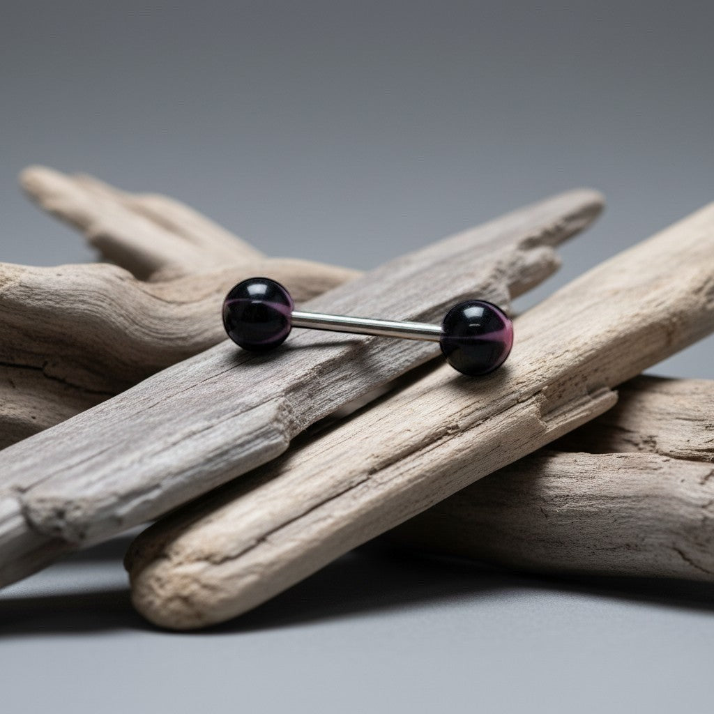 Aramat Jewels black and pink star acrylic tongue piercing. Features a 16mm bar with 1.6mm thickness.