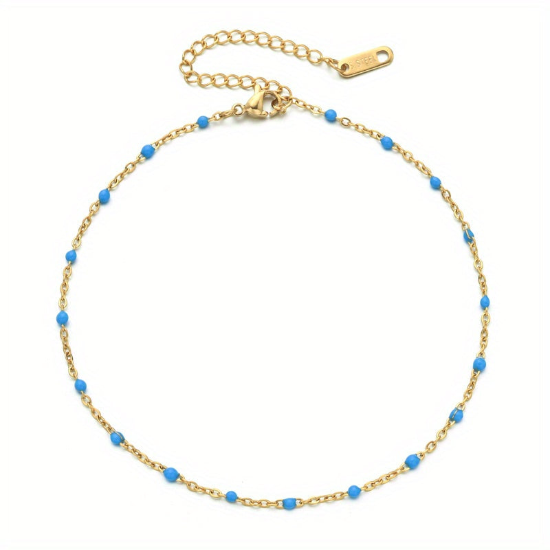 Een Gouden Armband Met Blauwe Kralen Van Aramat Jewels® Stalen Enkelbandje