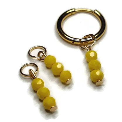 3 Facet Kralen Parelglans Oorbedels - Aramat Jewels®: Gele Plastic Kralen Op Gouden Ring.