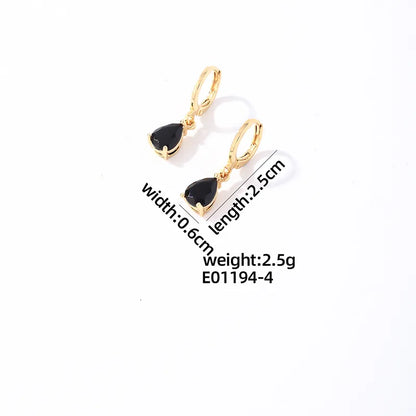 Stalen Huggie Oorringen Goudkleurig met Hangende Zwarte Druppel Zirkonia 25 mm