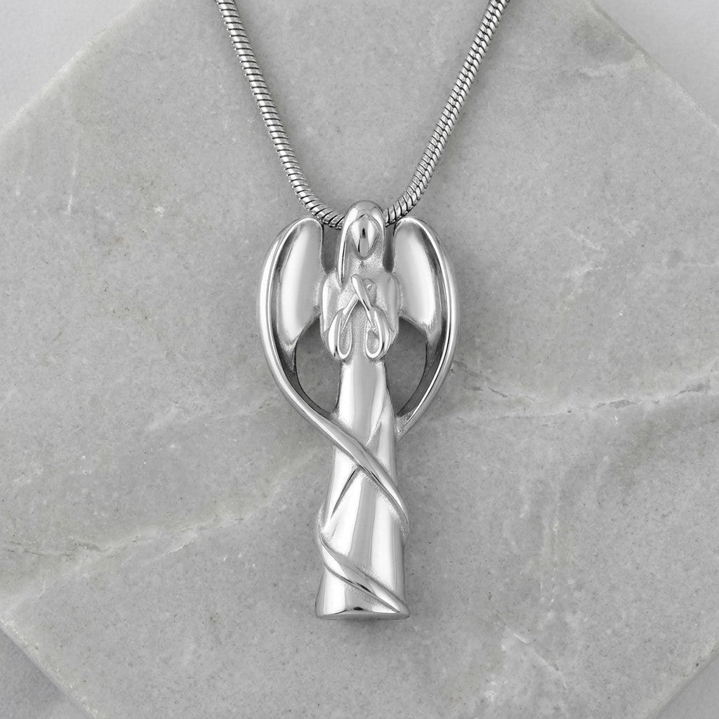 Aramat Jewels silver-colored stainless steel angel ash pendant with wings and a swirling ribbon detail. Symbolizes protection and comfort.