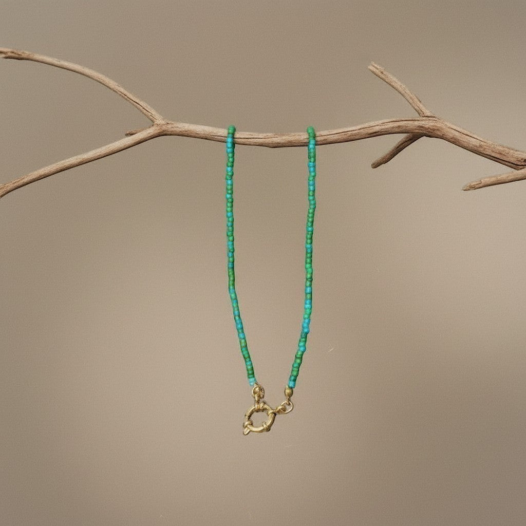 Aramat Jewels beaded necklace with blue and green seed beads and a gold-tone clasp.