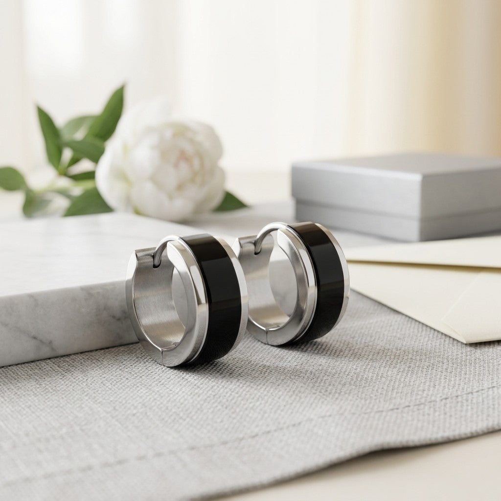 Aramat Jewels stainless steel hoop earrings with a glossy black and silver bicolor design, 13x7mm.