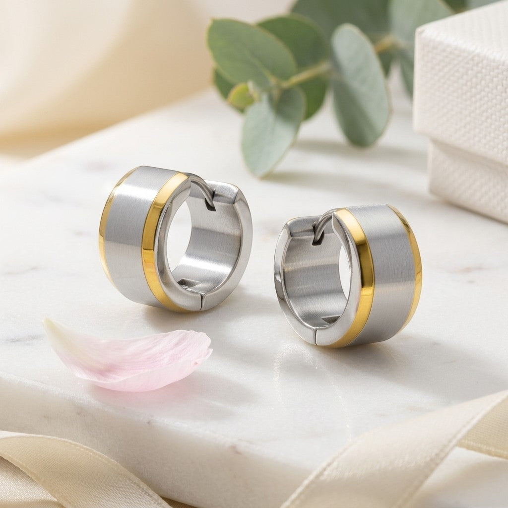 Aramat Jewels bicolor stainless steel hoop earrings with a wide gold stripe, 13mm diameter, unisex design.
