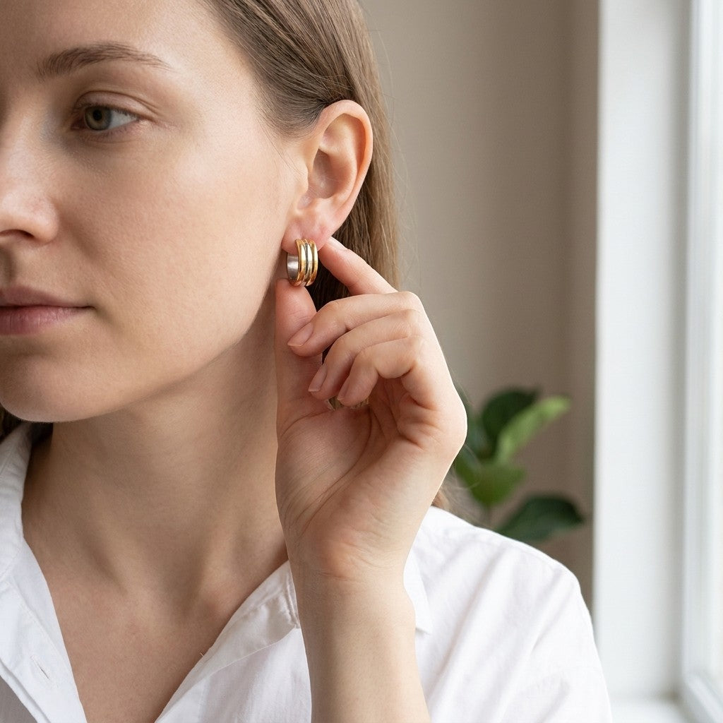 Aramat Jewels bicolor hoop earrings with gold and silver stripes, 13mm diameter, made of stainless steel.