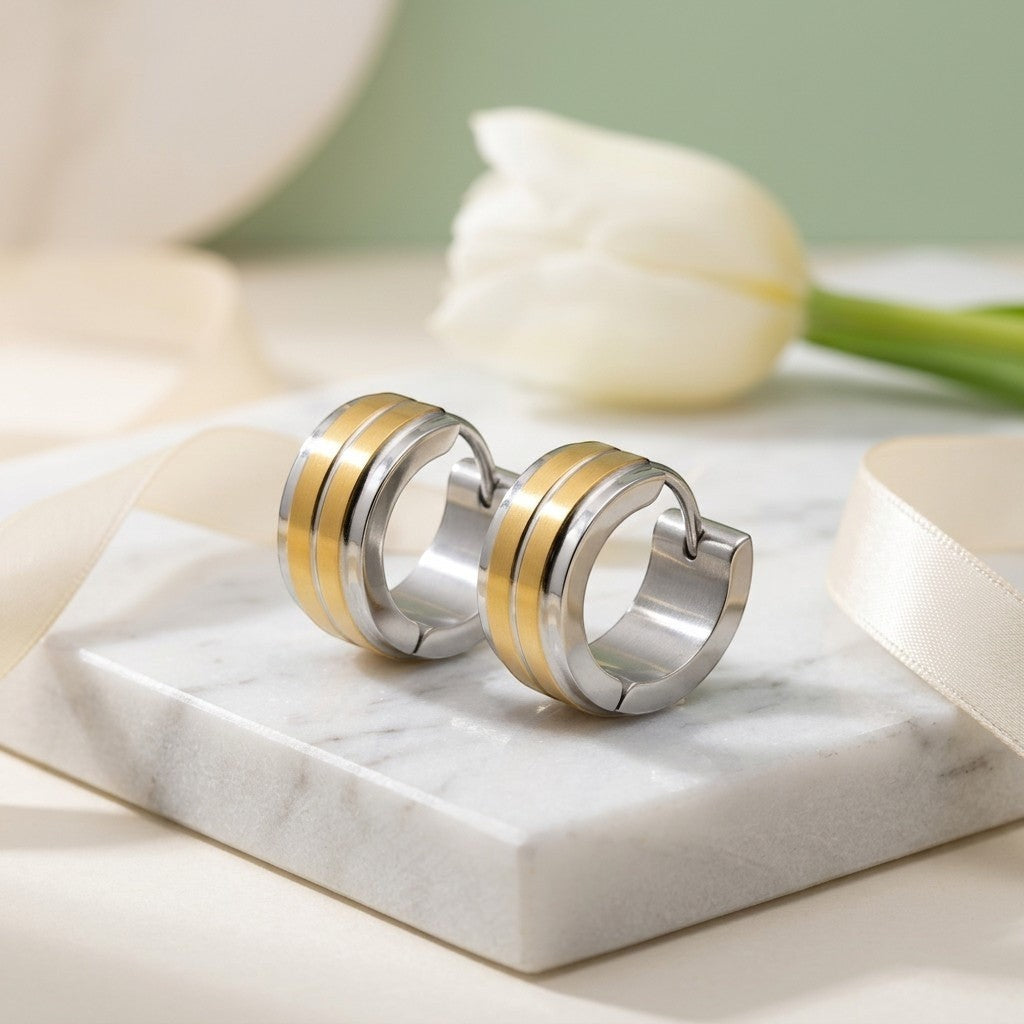 Aramat Jewels stainless steel bicolor huggie hoop earrings with double gold stripes, 13mm diameter.