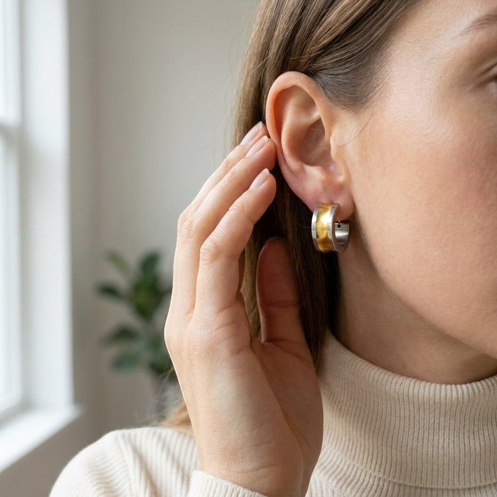 Aramat Jewels bicolor stainless steel hoop earrings with a wide gold stripe, 13mm.