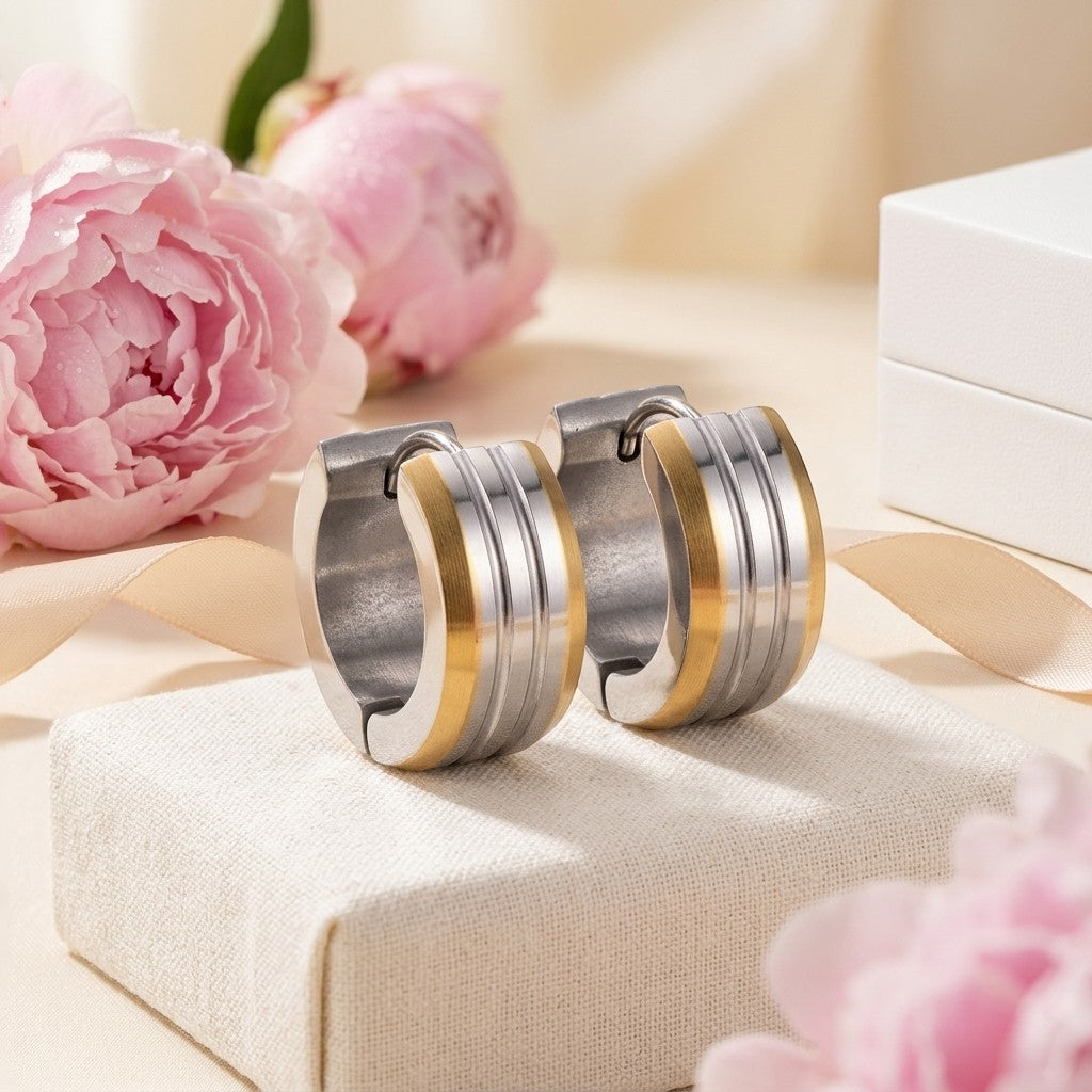 Aramat Jewels stainless steel bicolor hoop earrings with matte stripes, 13mm diameter, gold and silver tones.