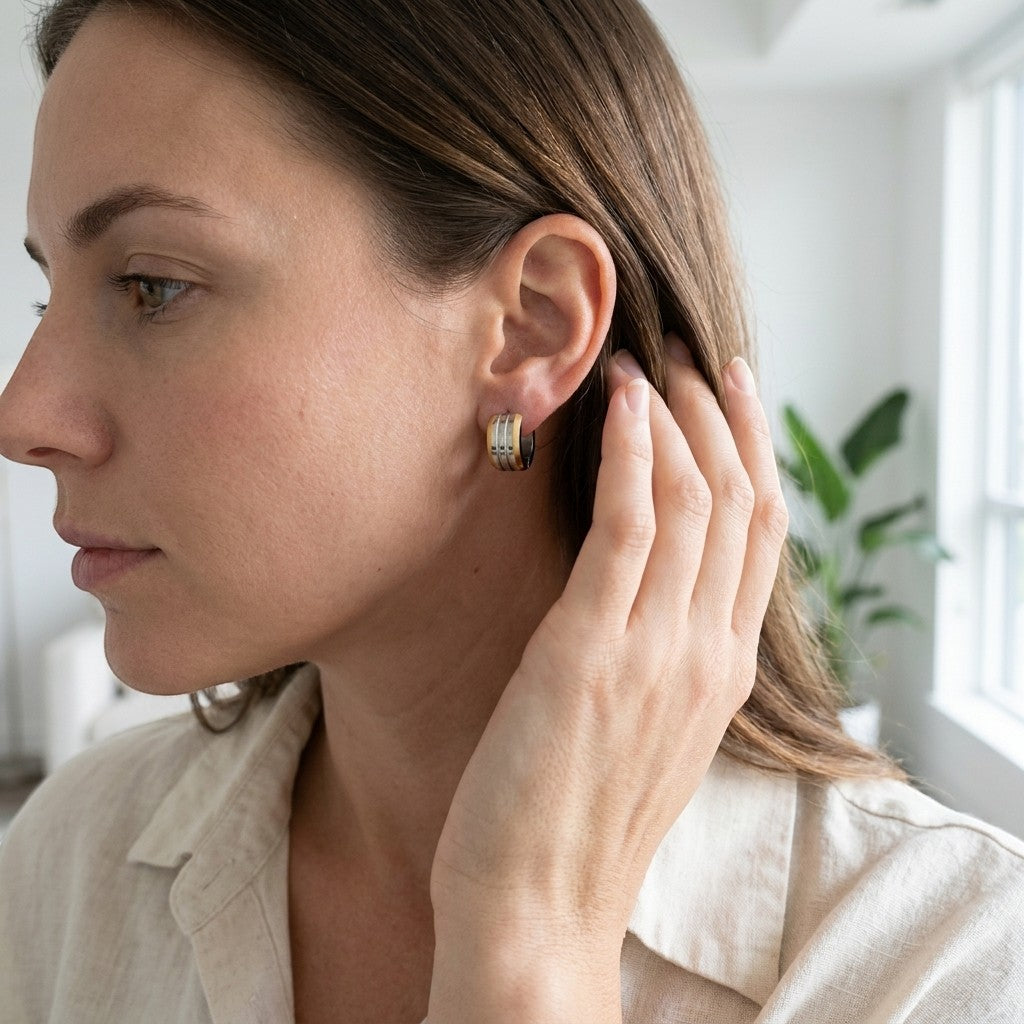 Aramat Jewels bicolor hoop earrings with matte stripes in gold and silver tones, 13mm diameter, made of stainless steel.