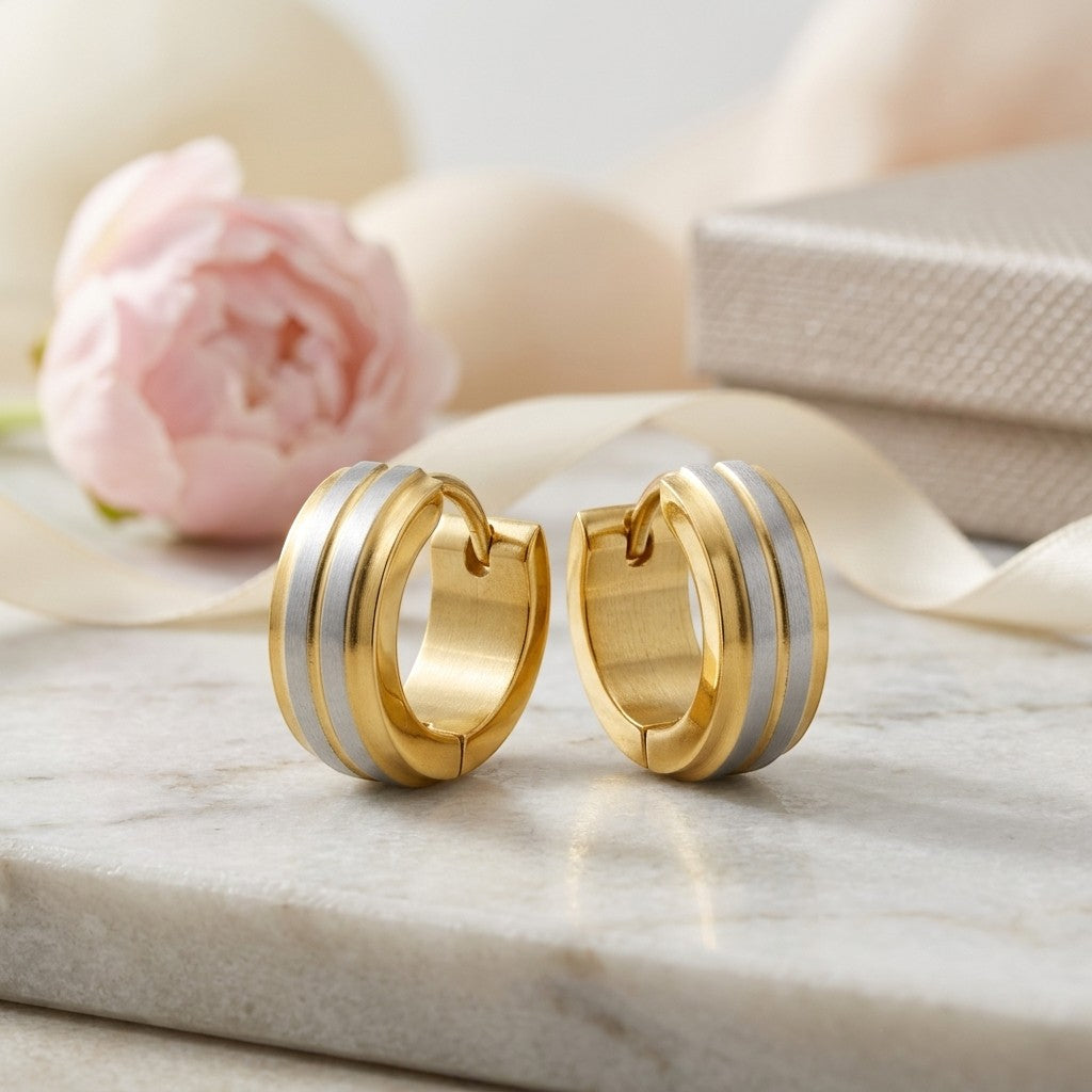 Aramat Jewels stainless steel bicolor hoop earrings, 13x5mm, with matte silver and gold stripes. Modern unisex design.