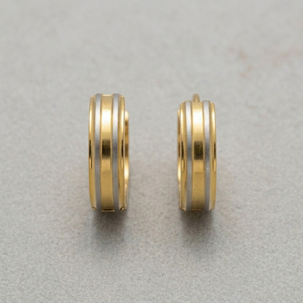 Aramat Jewels bicolor hoop earrings in matte silver with gold stripes, 13mm x 4mm, made of stainless steel.