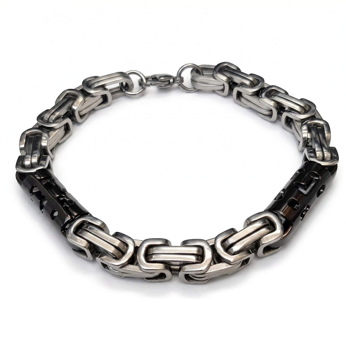 Aramat Jewels bicolor koningsschakel armband van roestvrij staal met zilverkleurige en zwarte schakels.