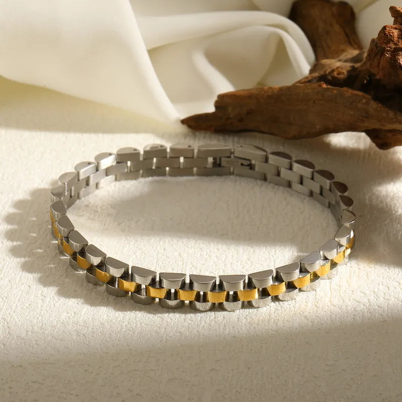 Aramat Jewels bicolor RVS horlogeband armband met zilver- en goudkleurige schakels van 21 cm lang en 8 mm breed.
