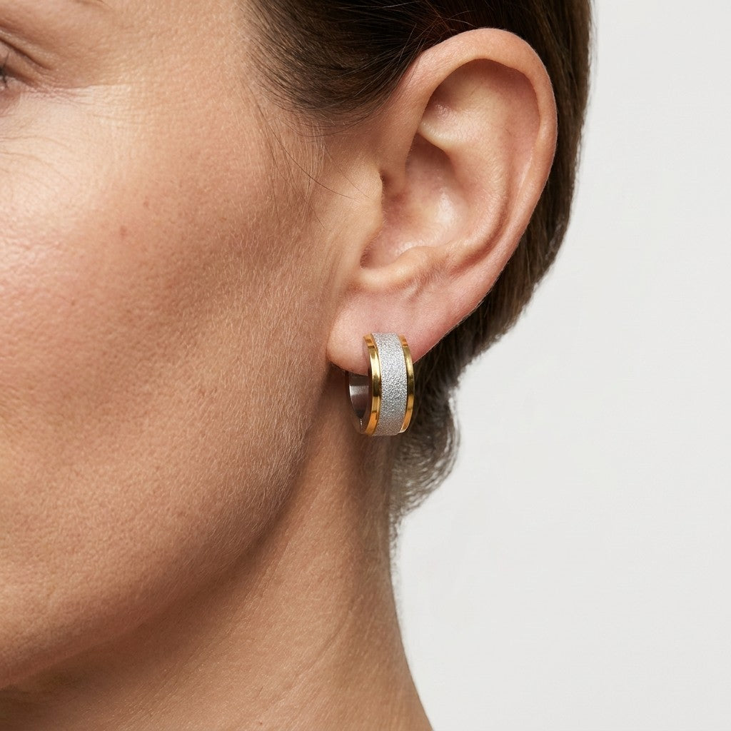 Aramat Jewels bicolor sandblasted stainless steel hoop earrings with a shiny silver stripe, 13x7mm.