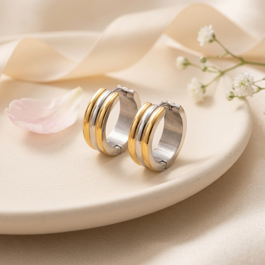 Aramat Jewels bicolor gold and silver striped stainless steel hoop earrings, 13mm diameter, 7mm width.