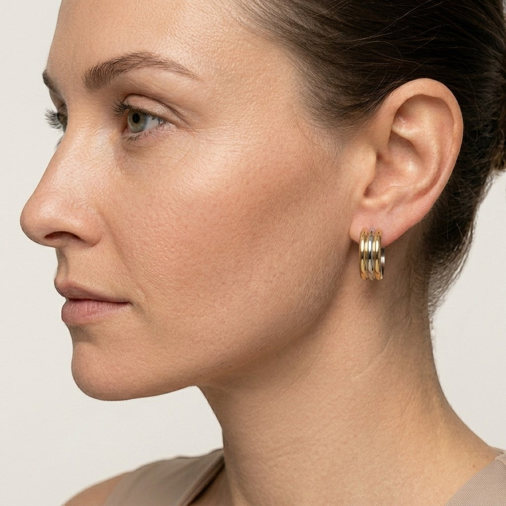 Aramat Jewels bicolor gold and silver striped hoop earrings, 13mm diameter, made of stainless steel.