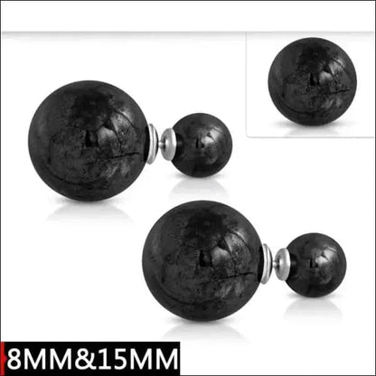 Aramat Jewels double pearl stud earrings featuring large and small black textured pearls in a modern design.