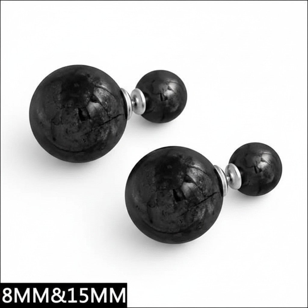 Aramat Jewels double pearl stud earrings featuring large and small black textured spheres in a modern design.
