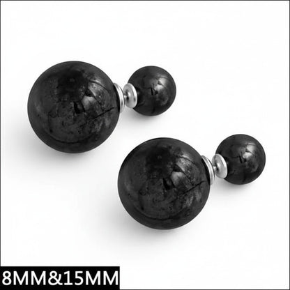 Aramat Jewels double pearl stud earrings featuring large and small black textured spheres in a modern design.
