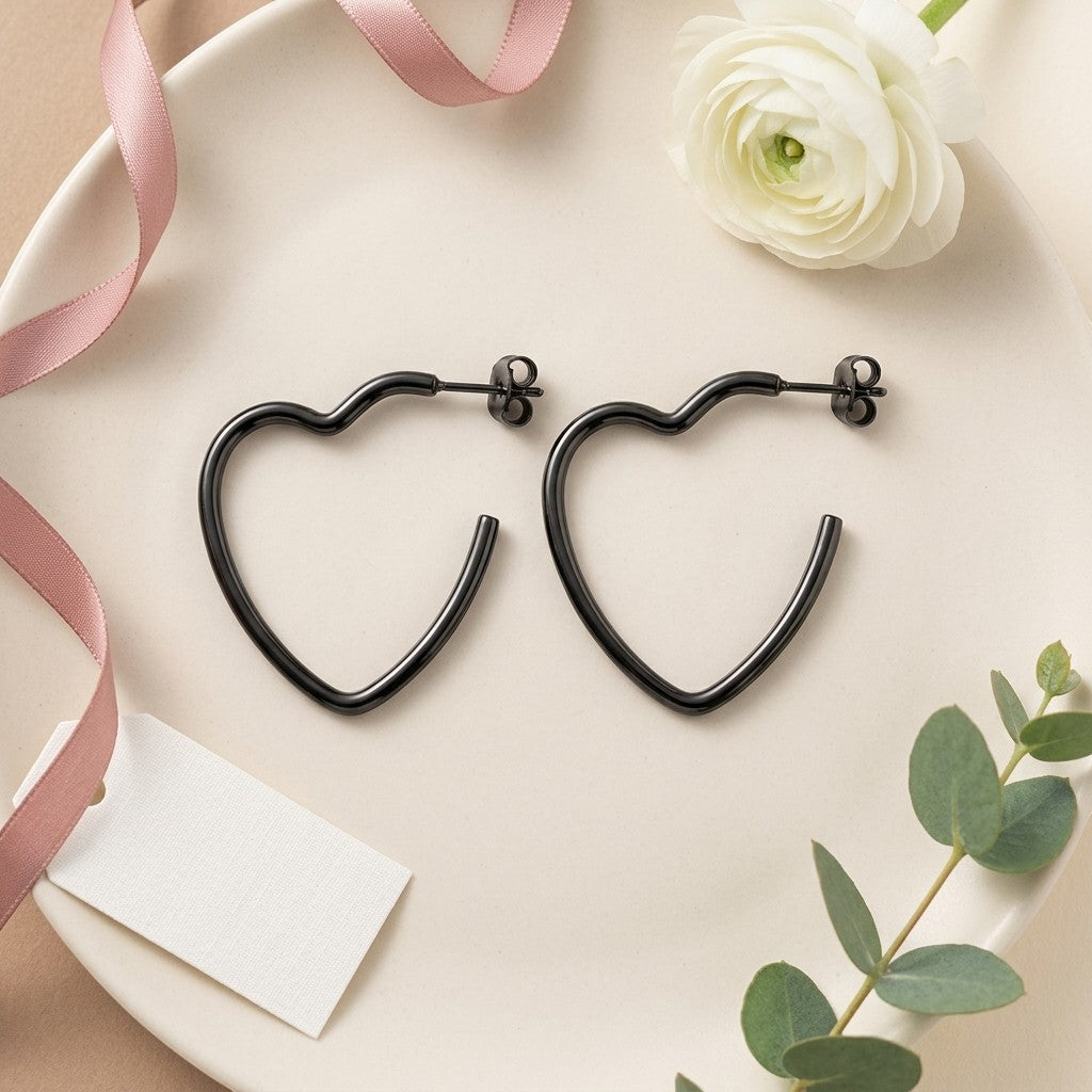 Aramat Jewels black heart-shaped hoop earrings made of stainless steel, 20mm diameter, with stud backs.