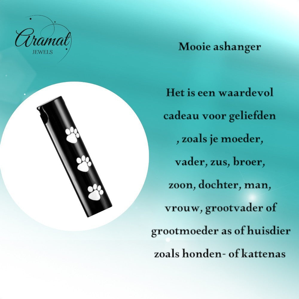 Aramat Jewels black stainless steel cremation urn pendant with white paw prints, cylindrical shape, 3.4cm.