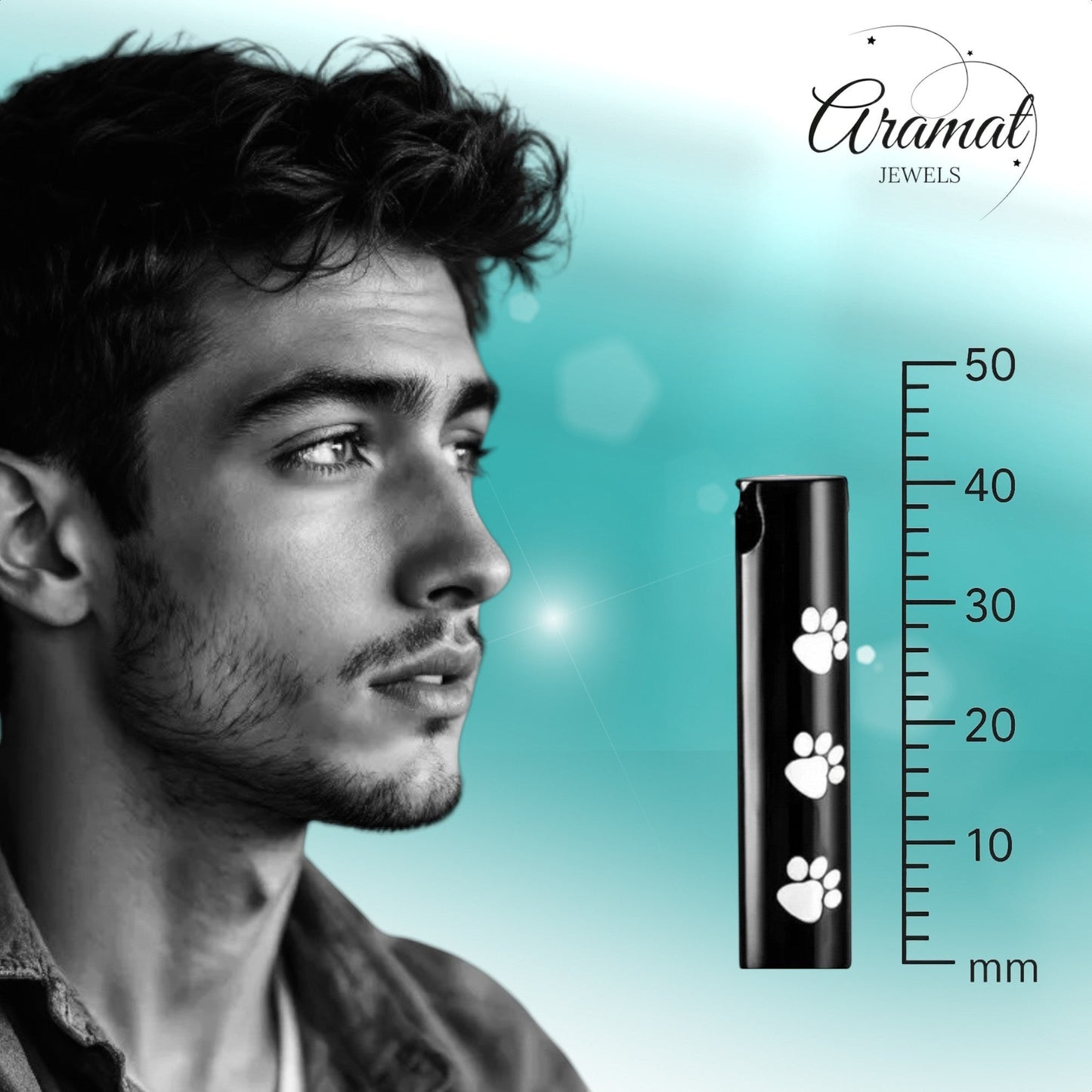 Aramat Jewels black stainless steel cremation urn pendant with white paw prints. Cylindrical shape, 3.4cm.