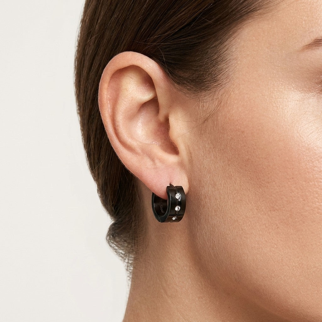 Aramat Jewels black stainless steel huggie earrings with clear cubic zirconia accents, 13mm diameter.