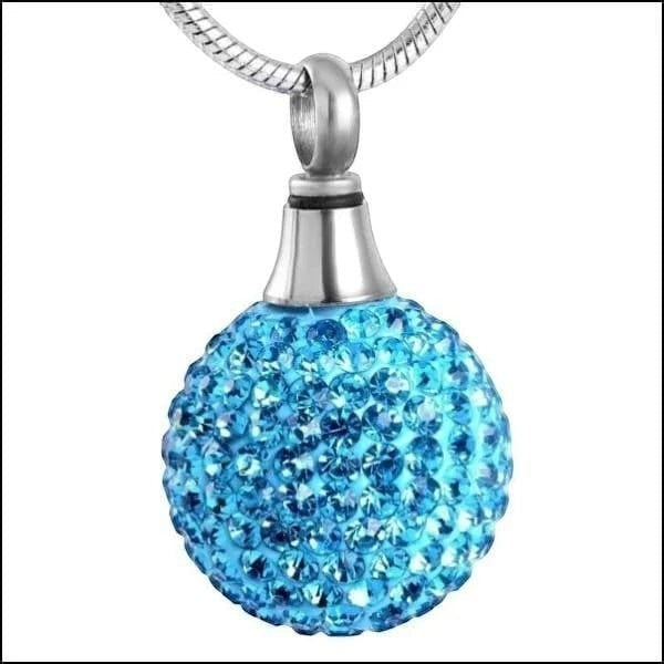 Aramat Jewels® blauwe bolvormige ashanger met zilverkleurige RVS schroefsluiting, bezet met kristallen.