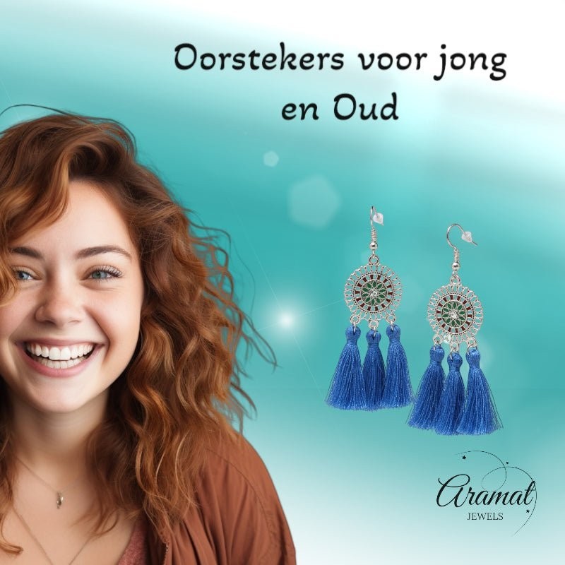 Aramat Jewels blue boho tassel earrings with stainless steel dreamcatcher design worn by a smiling woman