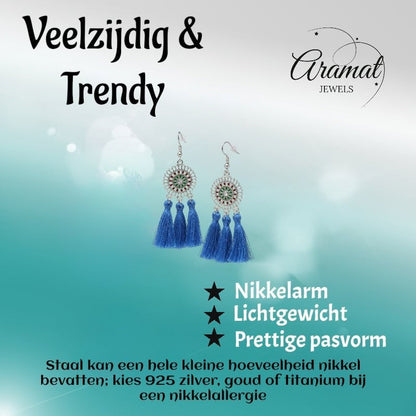 Aramat Jewels blue boho dangle earrings featuring three tassel drops and stainless steel accents on a light background.