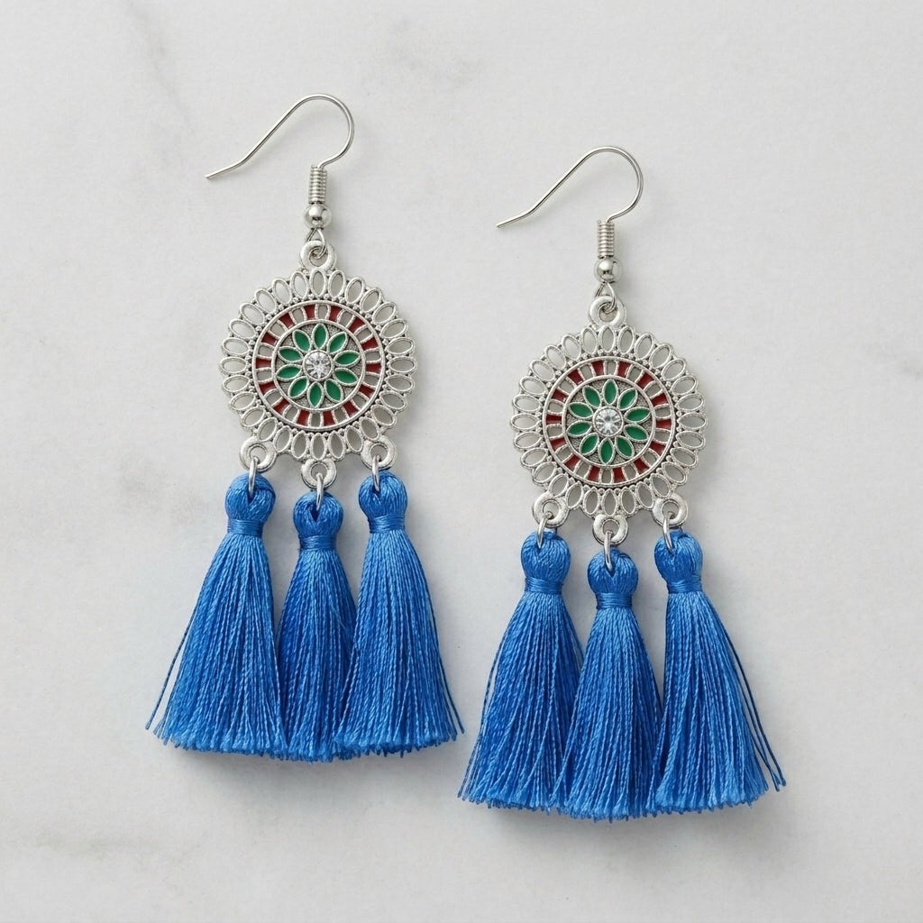 Aramat Jewels blue boho dangle earrings featuring three vibrant tassels and decorative stainless steel medallions.