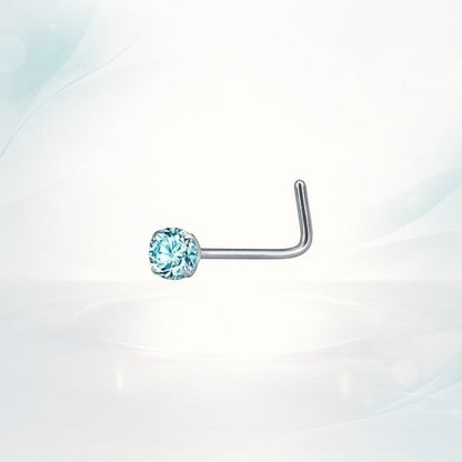 Aramat Jewels silver steel L-shaped nose piercing with a round blue zirconia stone.