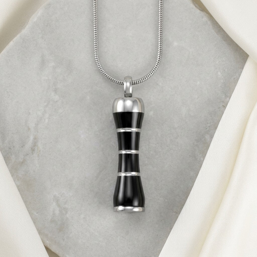 Aramat Jewels zwarte en zilverkleurige buis ashanger van 316L edelstaal met schroefsluiting.