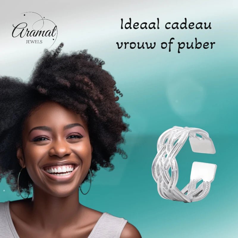 Aramat Jewels adjustable silver stainless steel ring with Celtic braided pattern worn by a smiling woman.
