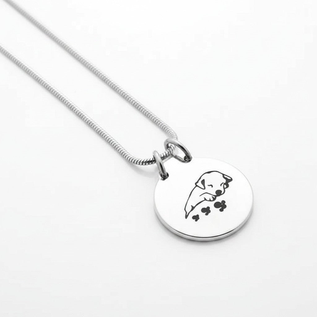 Aramat Jewels silver and black stainless steel dog ash pendant with chain, featuring a sleeping puppy design.