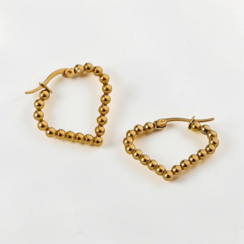 Aramat Jewels gold-colored stainless steel hoop earrings in a teardrop shape with a beaded design, 33mm.