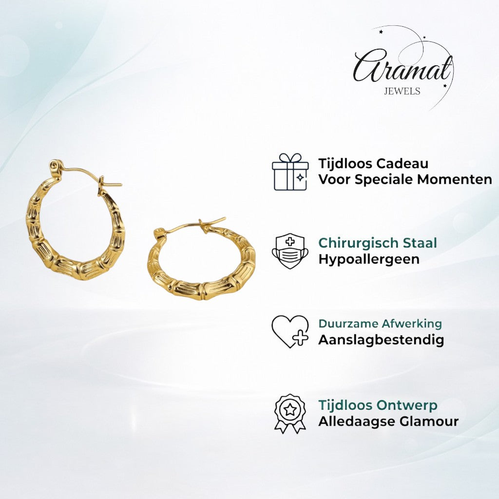Aramat Jewels gold-coloured stainless steel hoop earrings with a bone-structure texture, 25mm diameter.