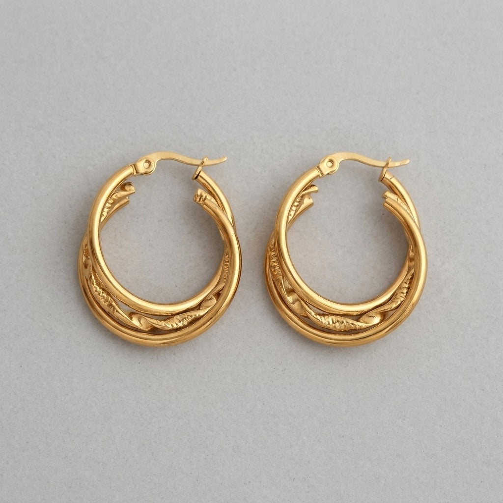 Aramat Jewels gold-tone stainless steel 3-layer hoop earrings with braided detail, 25mm diameter.