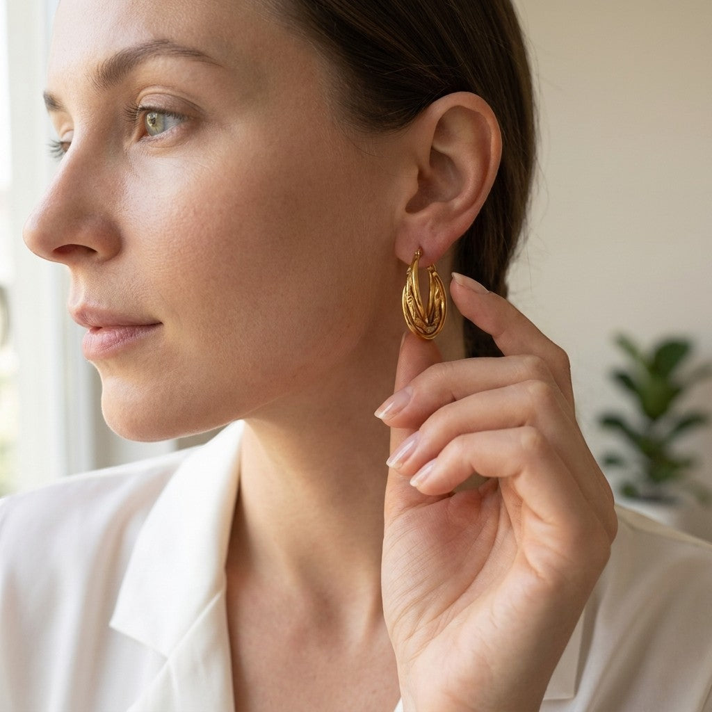 Aramat Jewels gold-tone stainless steel 3-layer hoop earrings with braided detail, 25mm diameter.