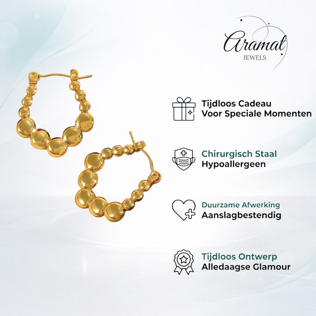 Aramat Jewels gold-coloured rectangular hoop earrings with a playful bubble pattern, made of stainless steel.