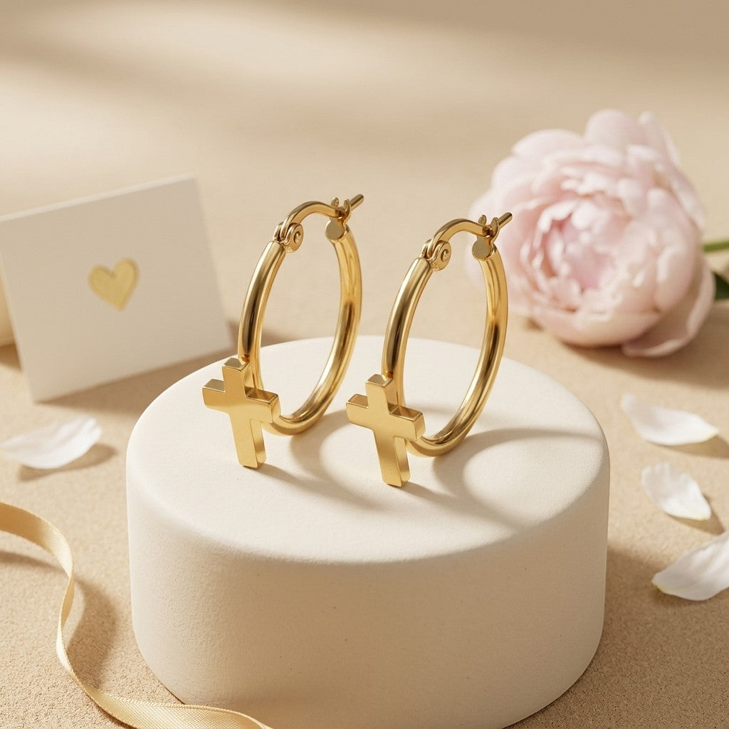Aramat Jewels gold-tone stainless steel hoop earrings with dangling cross charms, 25mm diameter.