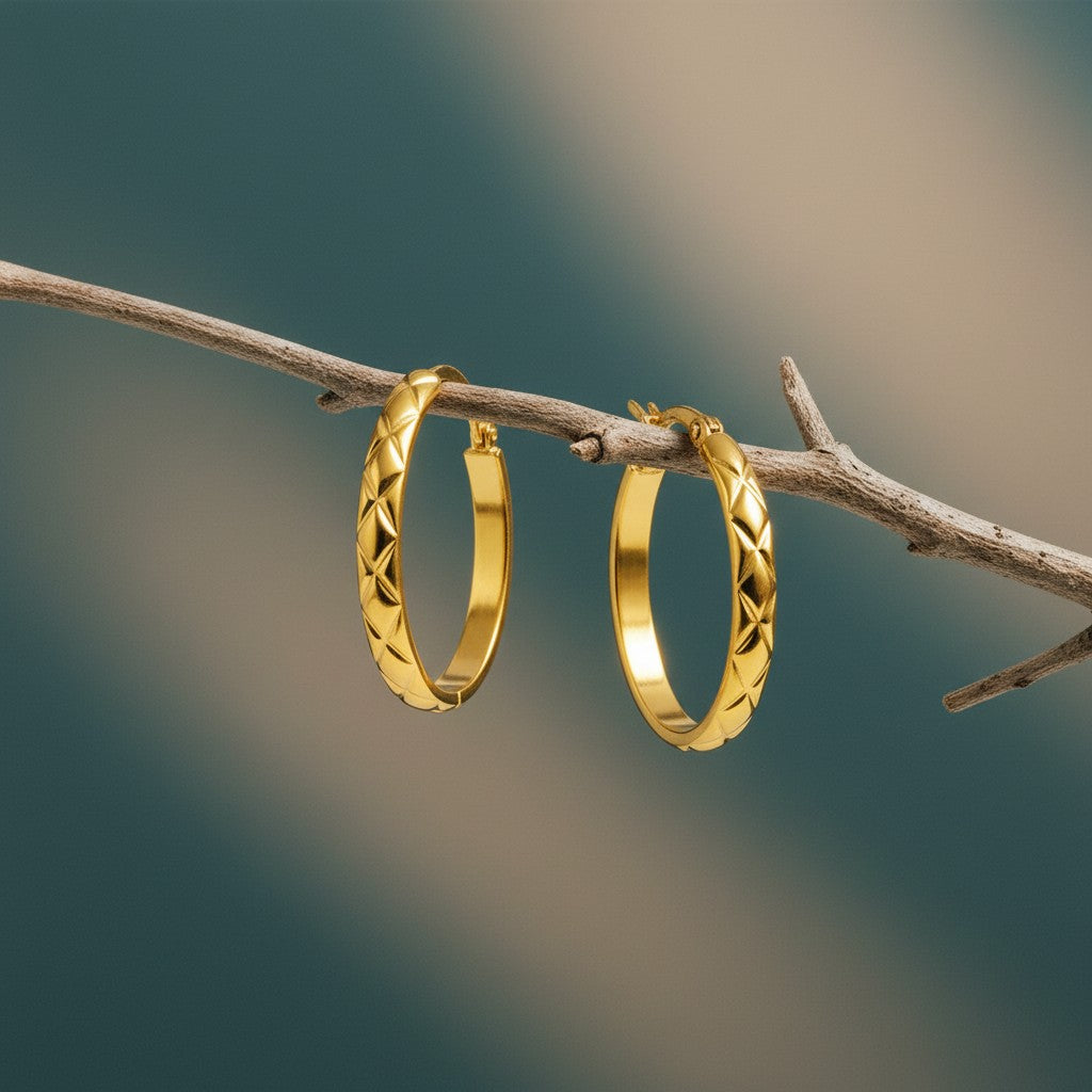 Aramat Jewels gold-tone stainless steel hoop earrings with a diamond pattern, 30mm diameter.