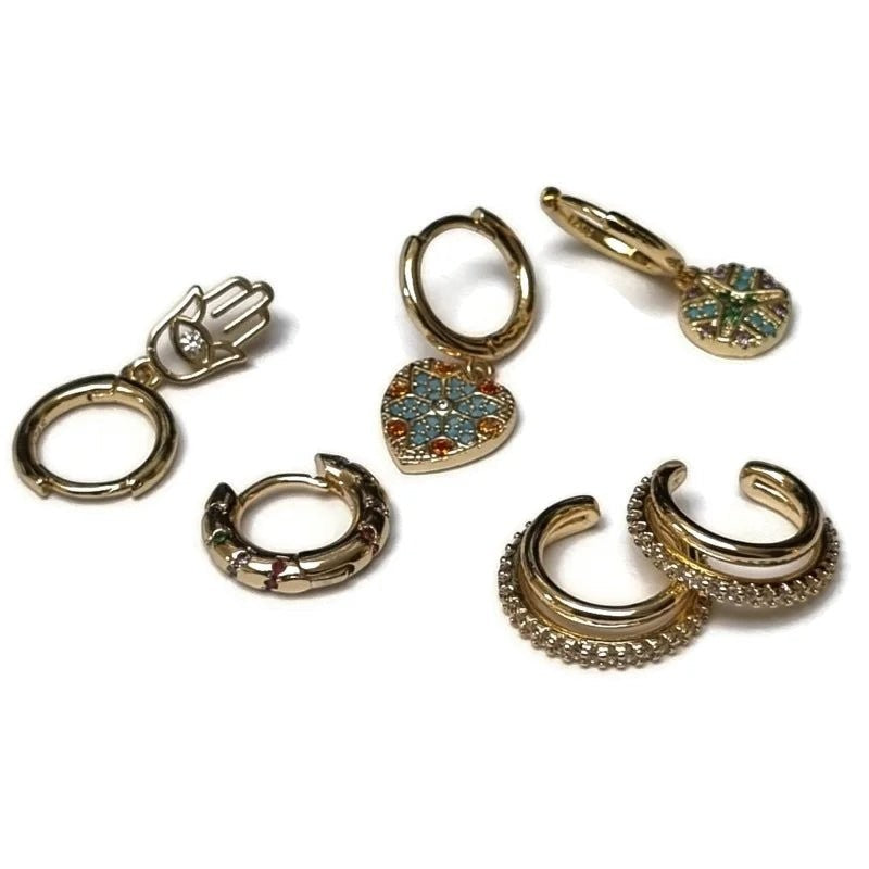 Aramat Jewels gold-plated 925 silver earring set with cubic zirconia, including huggies, ear cuffs, and charms.