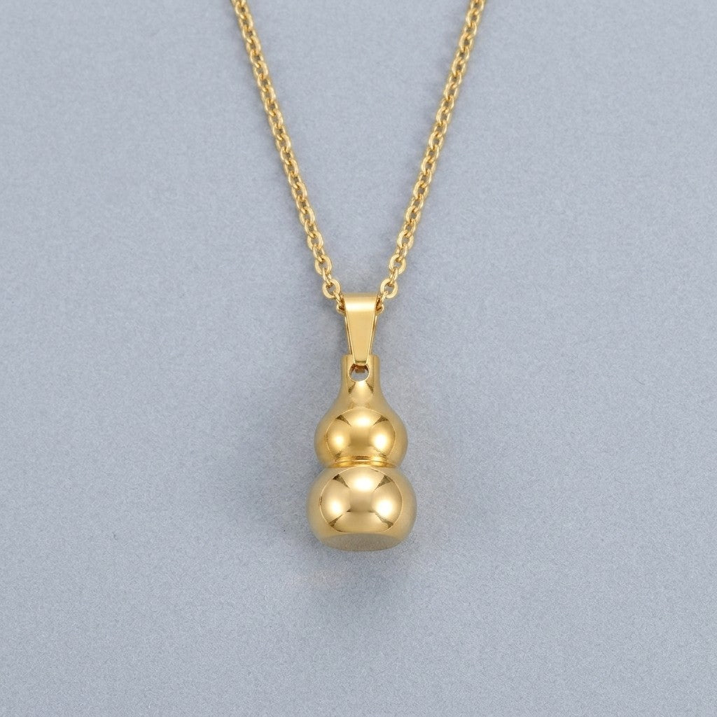Aramat Jewels gold-tone stainless steel gourd-shaped ash pendant necklace, 3x1.4cm, water-resistant, symbolic of luck and protection.