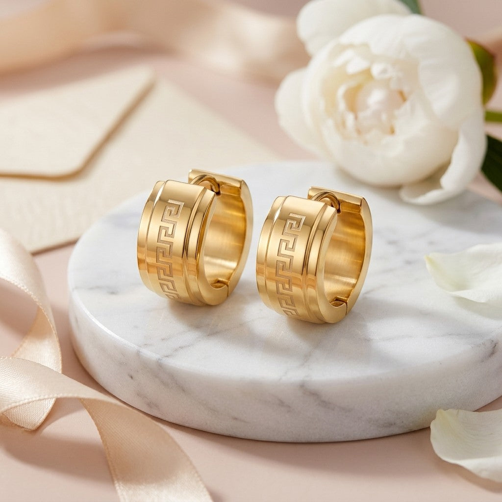 Aramat Jewels gold-tone stainless steel hoop earrings with Greek key pattern, 13mm or 20mm diameter.