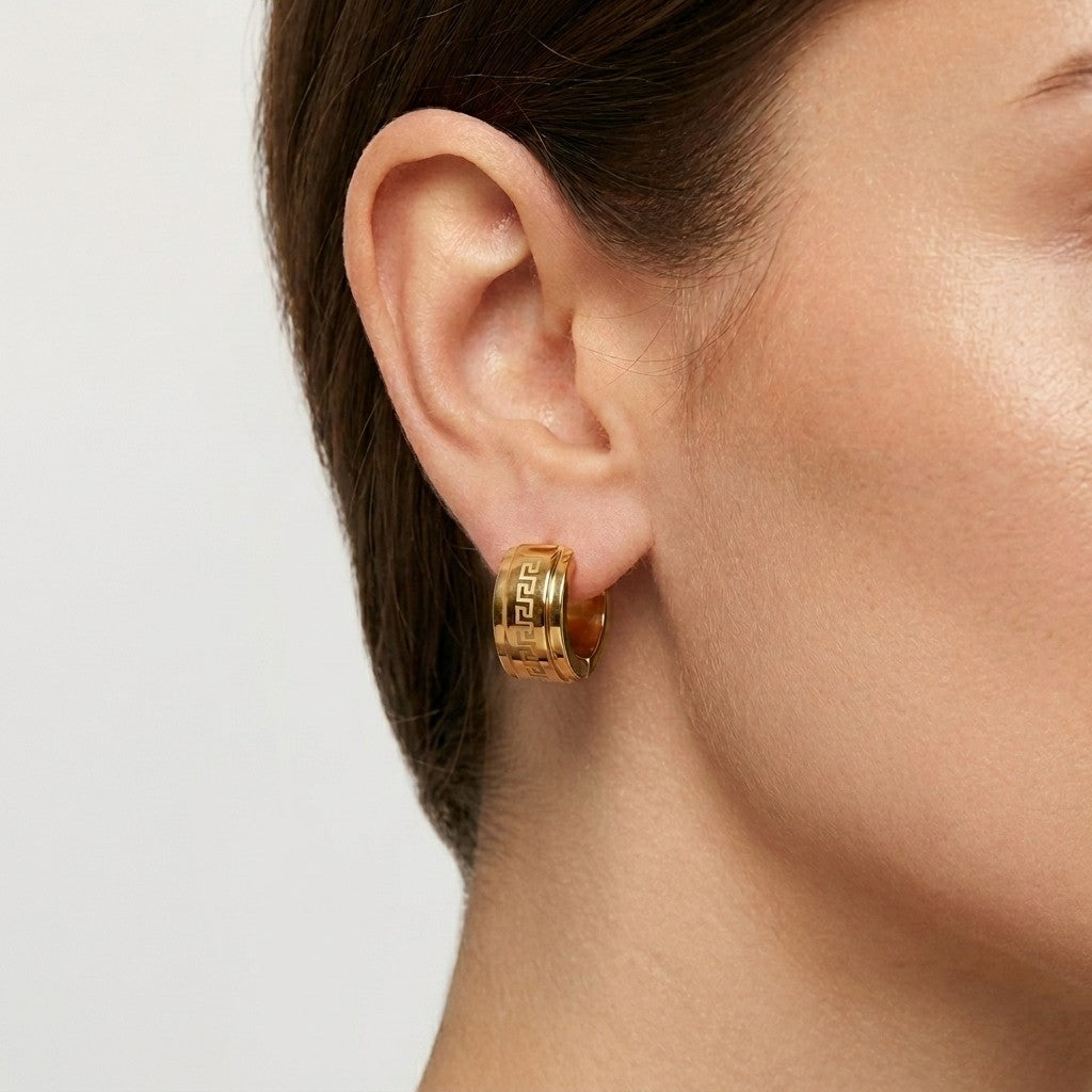 Aramat Jewels gold-tone stainless steel hoop earrings with Greek key pattern, 13mm or 20mm diameter.