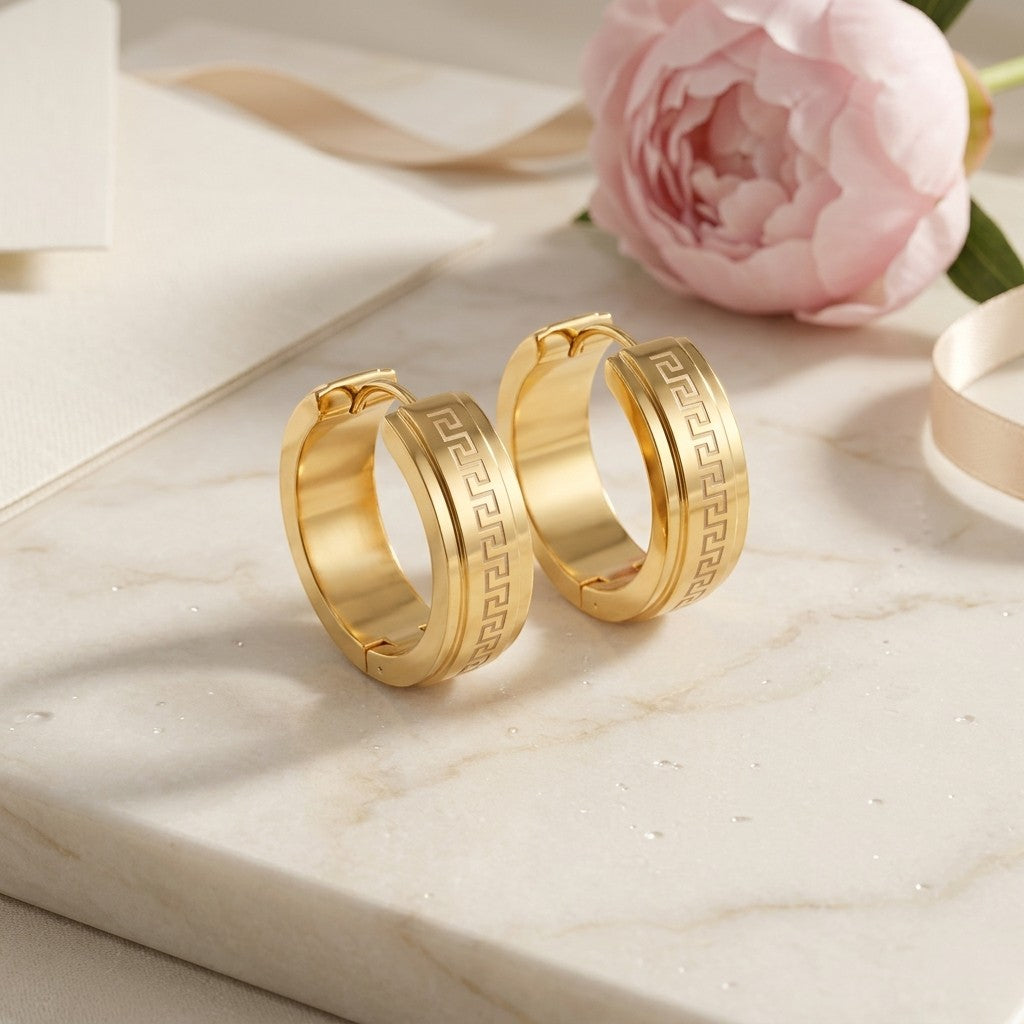 Aramat Jewels gold-tone stainless steel hoop earrings with Greek key pattern, 13mm or 20mm diameter.